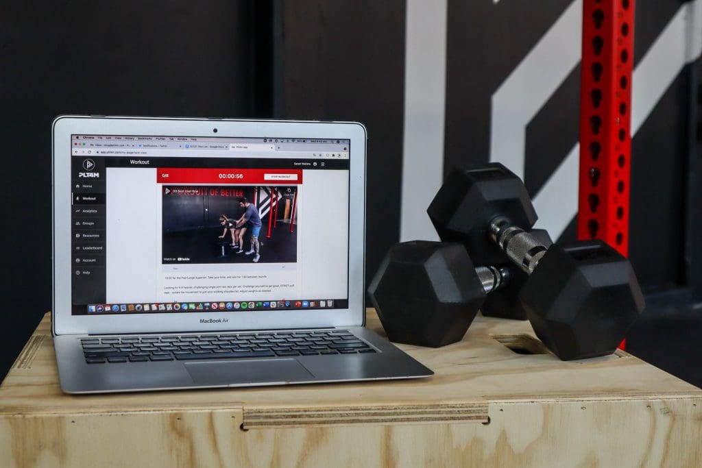 PLT4M on a lap top in weight room.