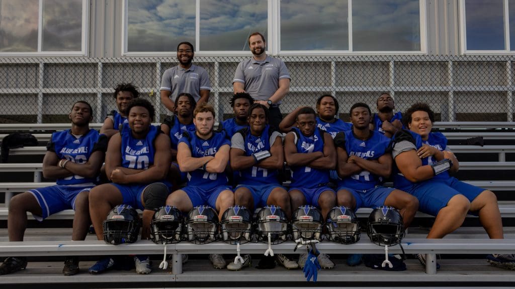 A football team takes their team photo.