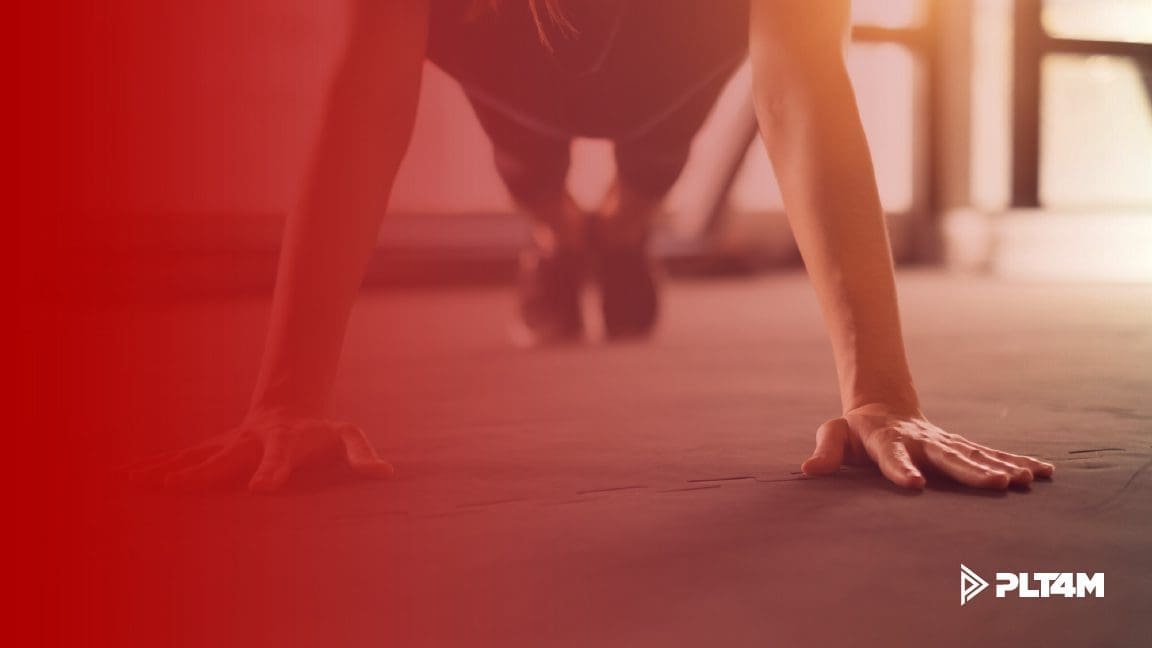 Person is at the top of a push up plank.