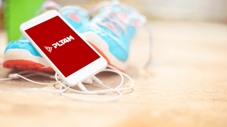 PLT4M app displayed on a phone.