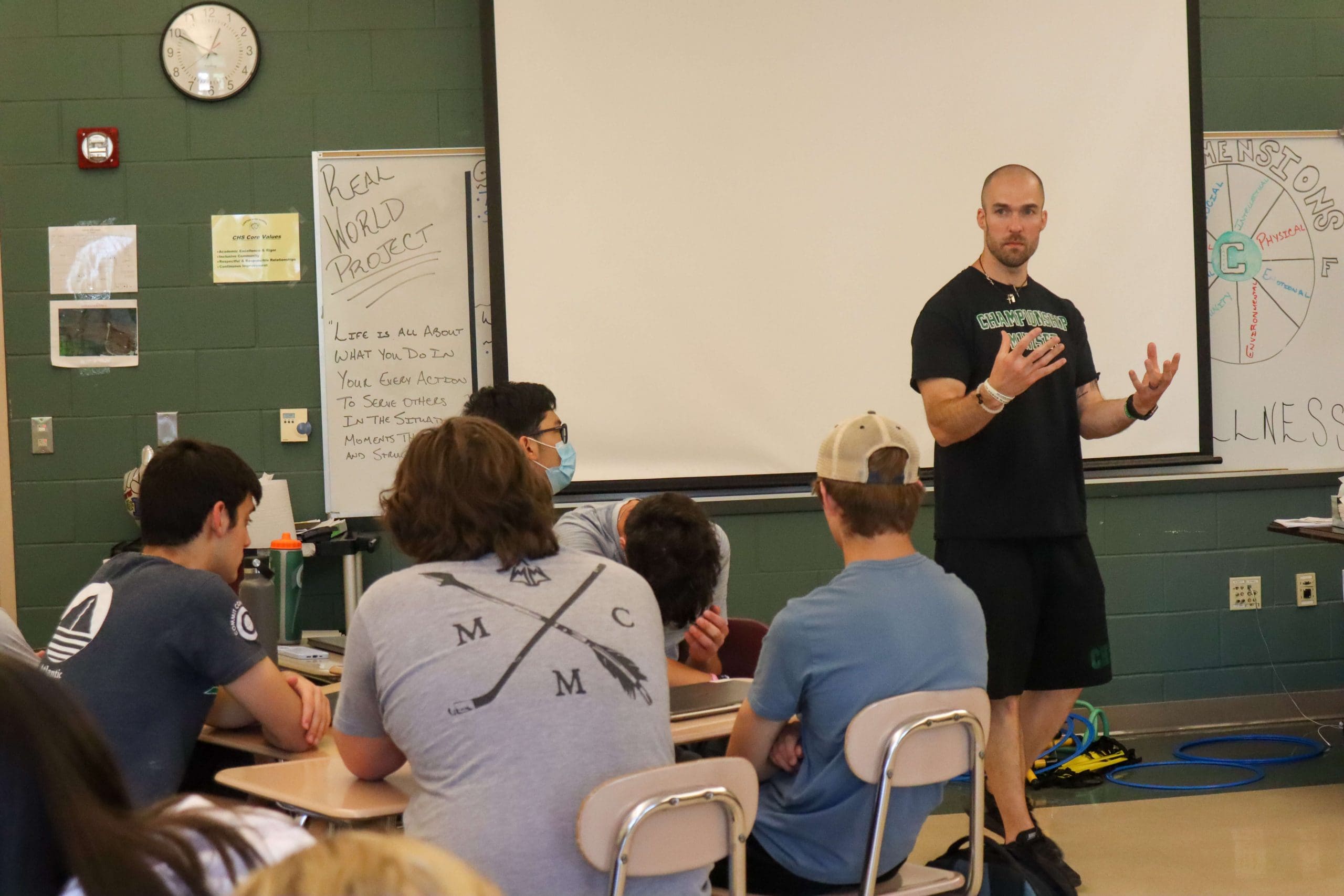 A teacher introduces a nutrition concept during a physical education class.