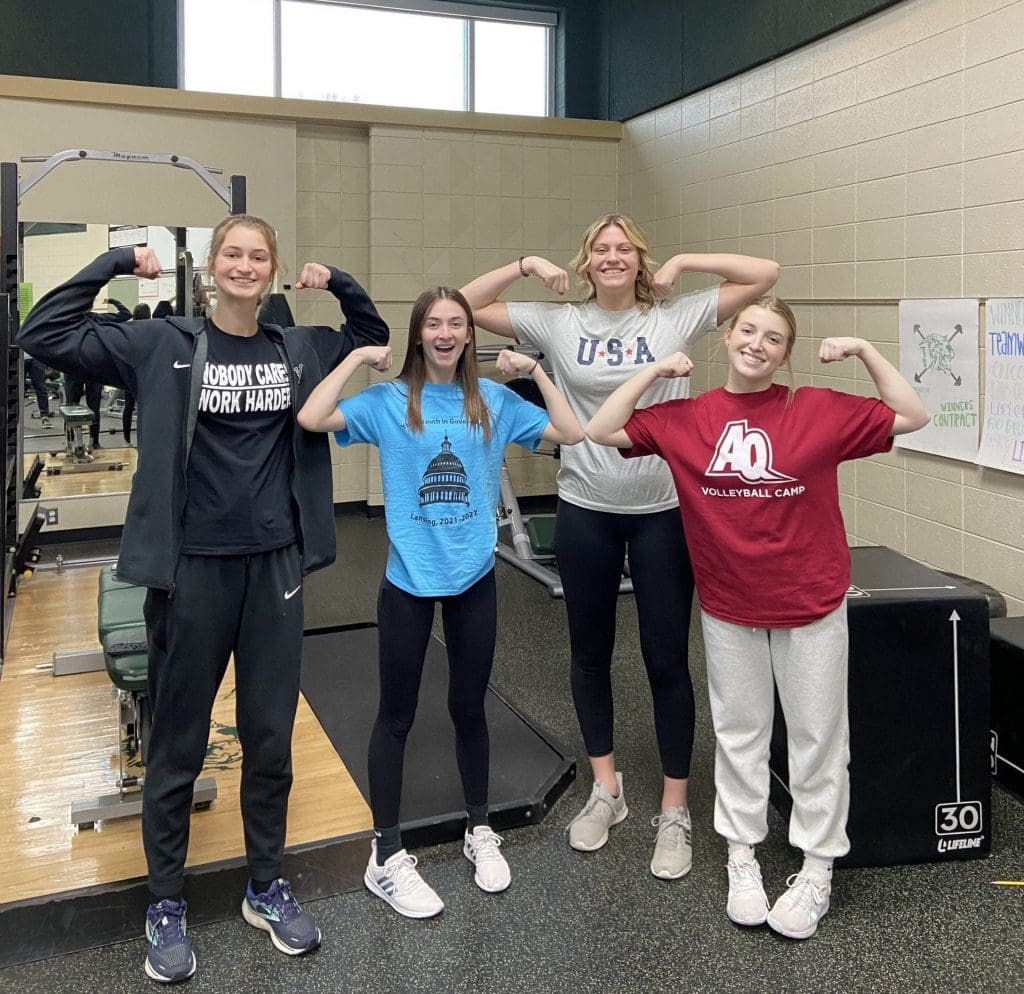 Female students flexing in a strength and conditioning class at Wayland Union High School.