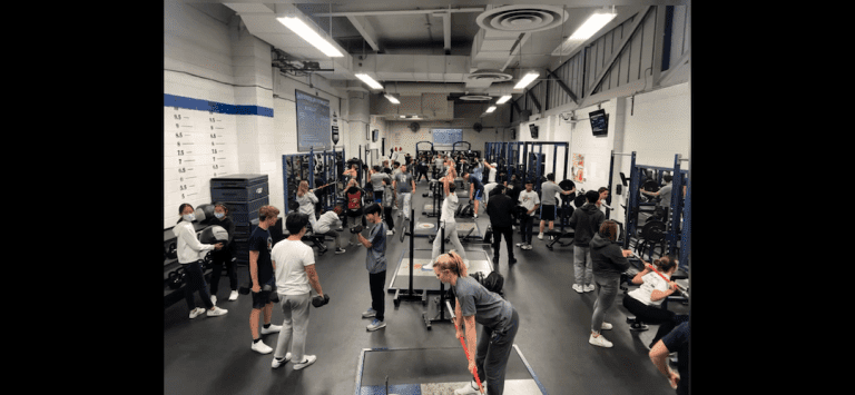 A bird's eye view of the Naperville North weight room where students participate in a strength and performance class.