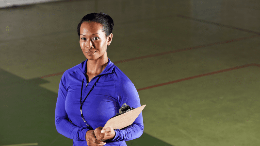 A physical education teacher poses for a photo.