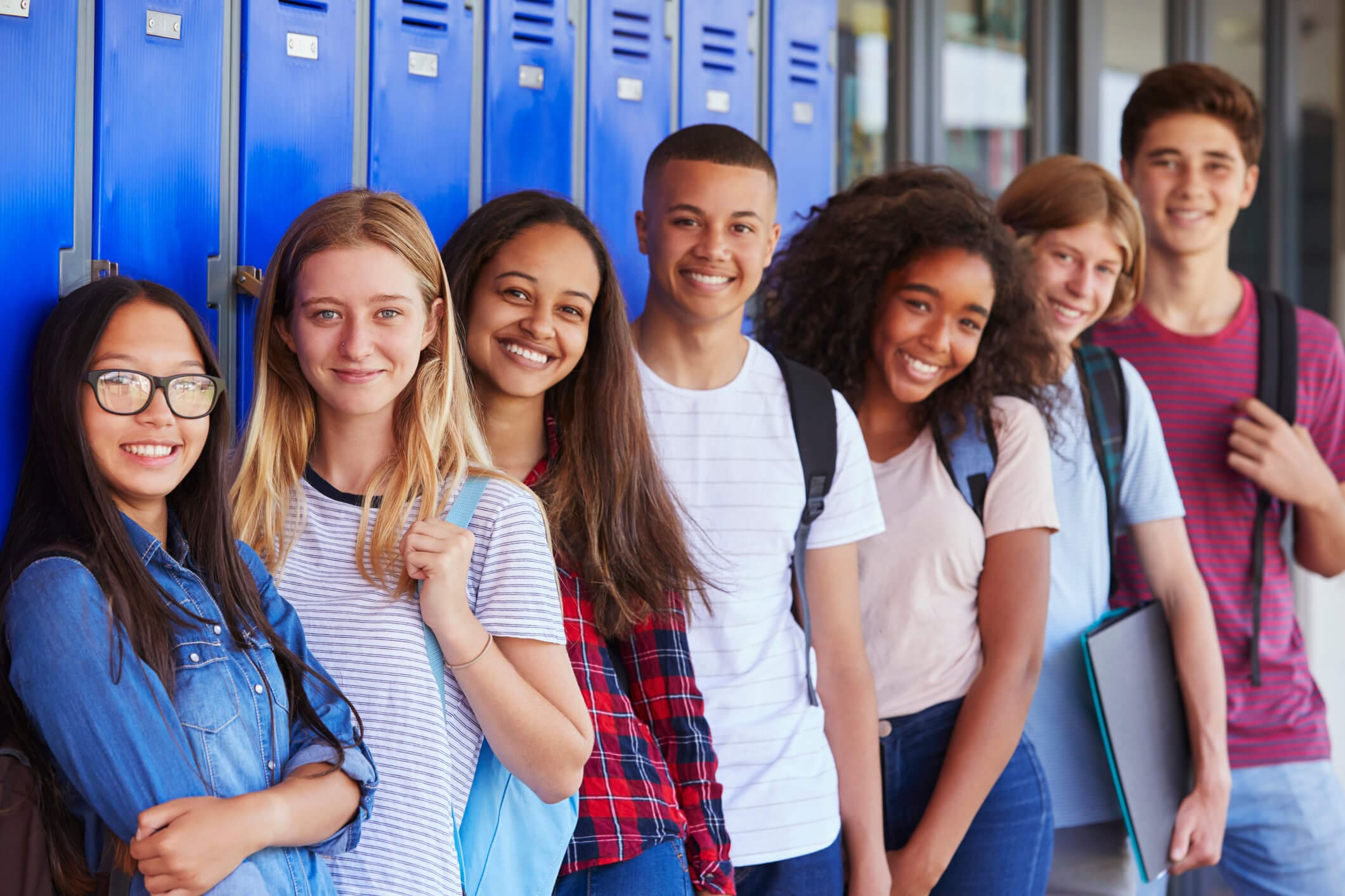 Group of students by lockers.