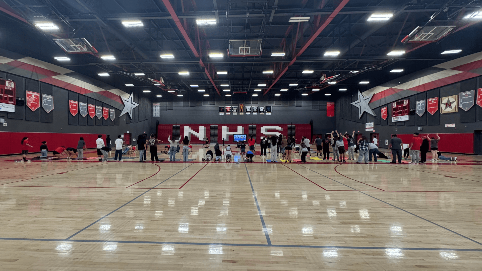 Double PE class at North High School in California completing a bodyweight bootcamp workout.