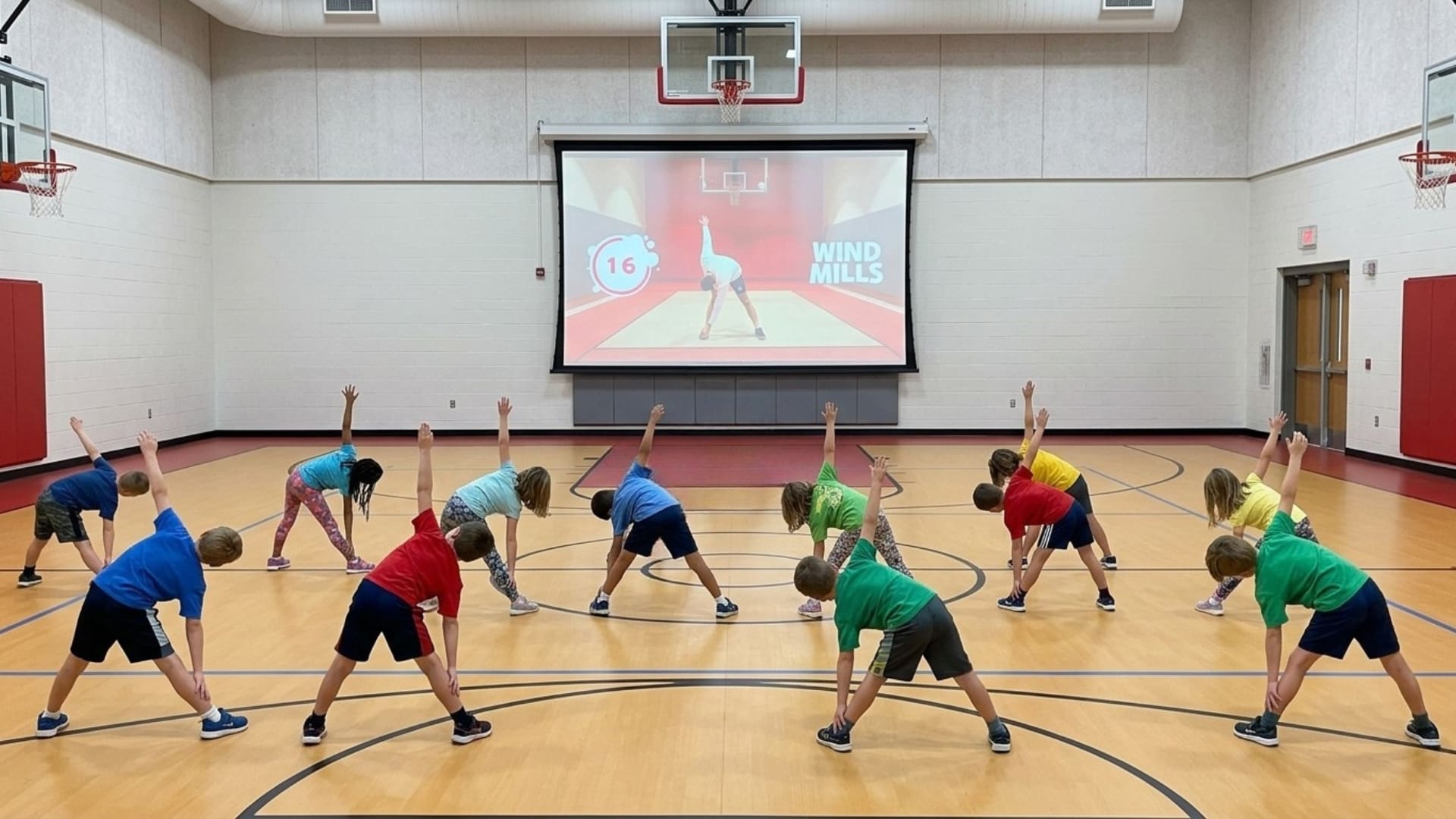students taking part in a plt4m elementary pe warm up
