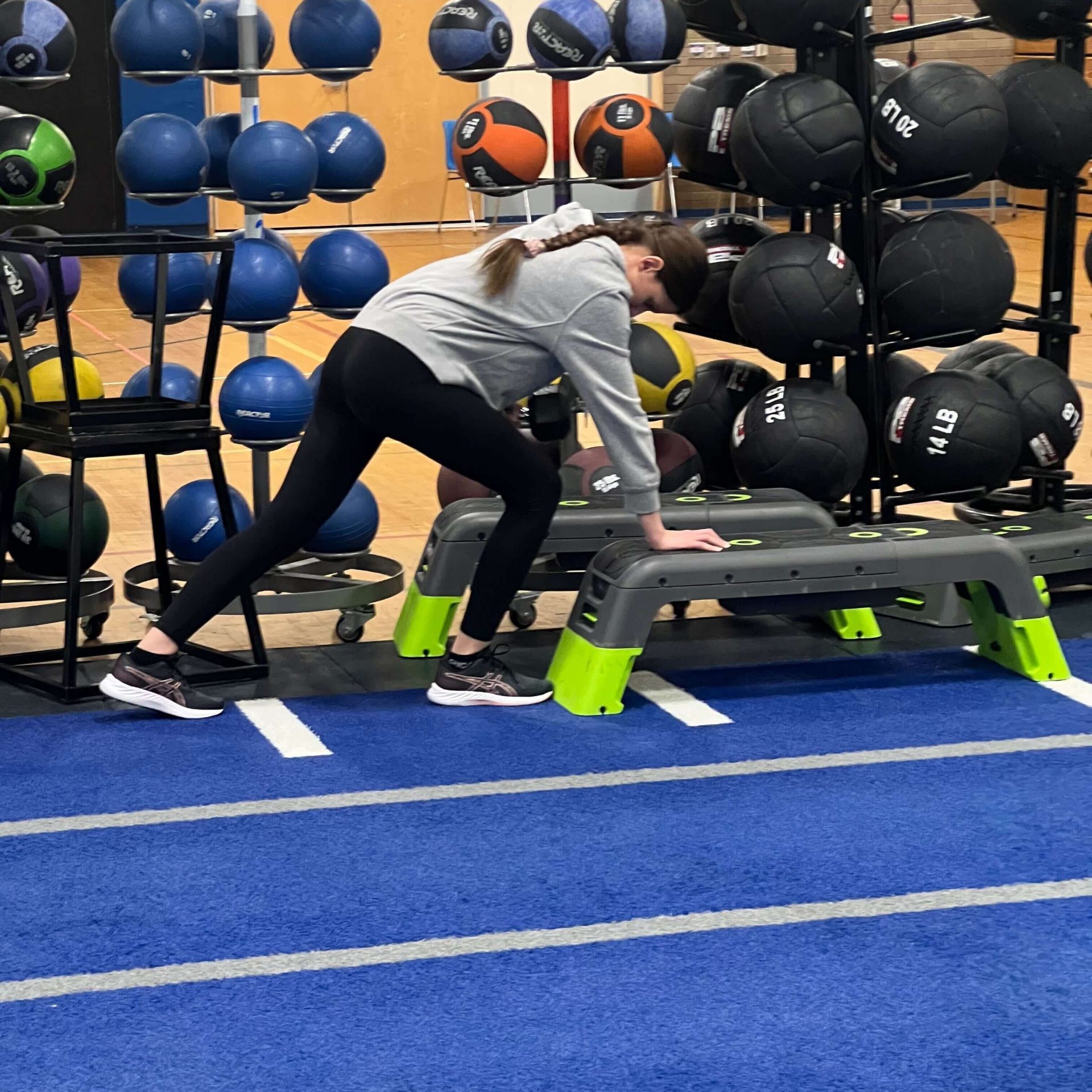 Shaker A female student does a bent over row.