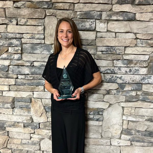 Jodi Reardon Jodi Reardon with her physical education teacher of the year award.