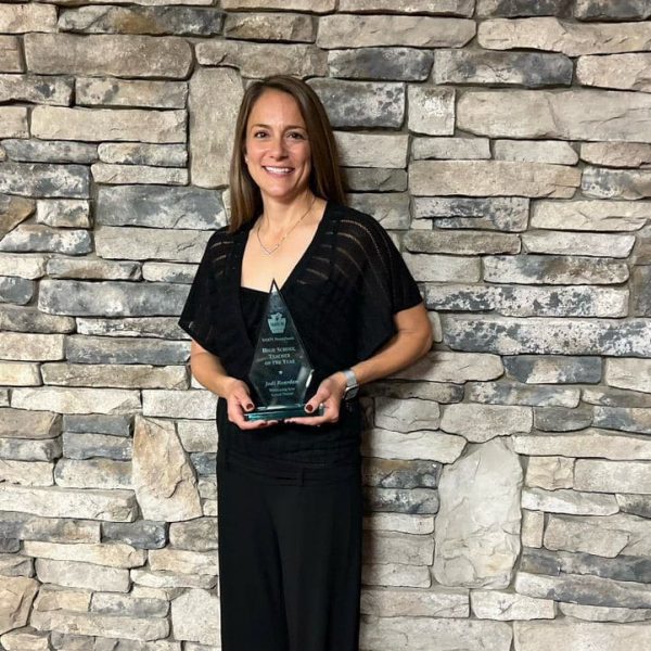 Jodi Reardon with her physical education teacher of the year award.